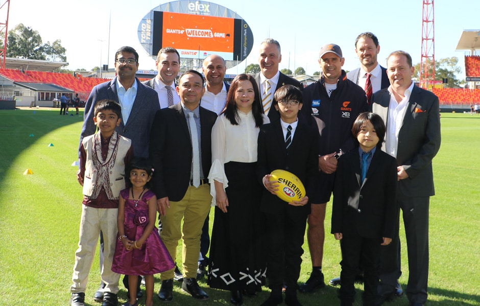 The GIANTS' Round 9 Clash Will Be The Welcome Game, with a GIANT Citizenship Ceremony pre-game Hon. Minister John Sidoti, NSW Minister for Multiculturalism and Sport, GIANTS CEO David Matthews, GIANTS coach Leon Cameron, GIANTS Board Member Adrian Fonseca, AFL NSW/ACT CEO Sam Graham and Multicultural NSW CEO Joseph La Posta meet with two of the families who will be part of the GIANT Citizenship Ceremony on Sunday. - AFL,GWS Giants,GIANTS Stadium,Carlton